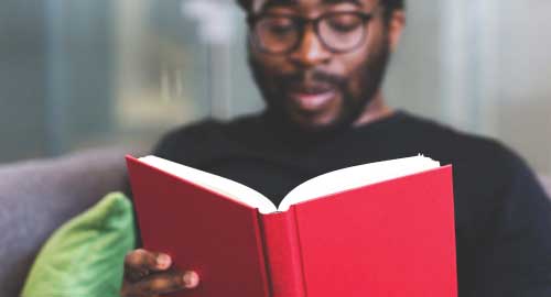 Person reading a book.